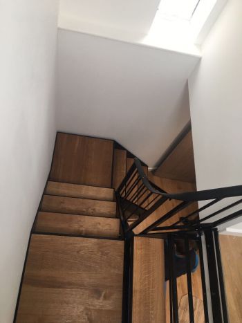 Internal metal staircase with oak treads