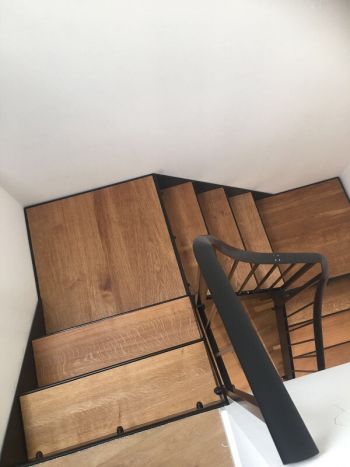 Internal metal staircase with oak treads